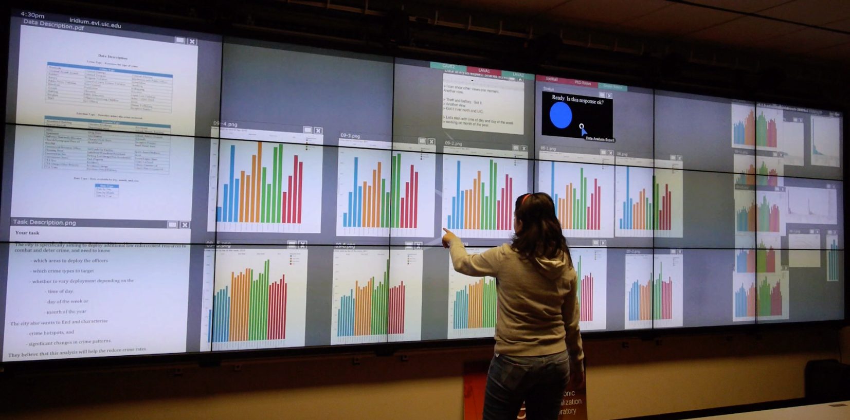 Research subject involved in an exploratory data analysis task using the EVL Cyber-Commons tiled display wall.