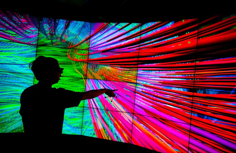 Participant in CAVE2 Hybrid Reality Environment