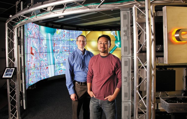 Andy Johnson (CS assoc. prof.) and Jason Leigh (CS prof. & EVL director) at the entrance to the CAVE2™ System.