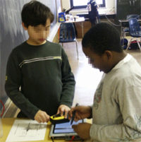 Students Interact with Tablet Computer for RoomQuake Distributed Earthquake Simulation