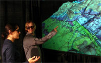 Students wear lightweight polarized glasses to view a stereoscopic GeoWall application showing the topography of Hickey Mountain, Arizona