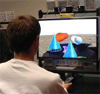 A user seated at the Personal Varrier system