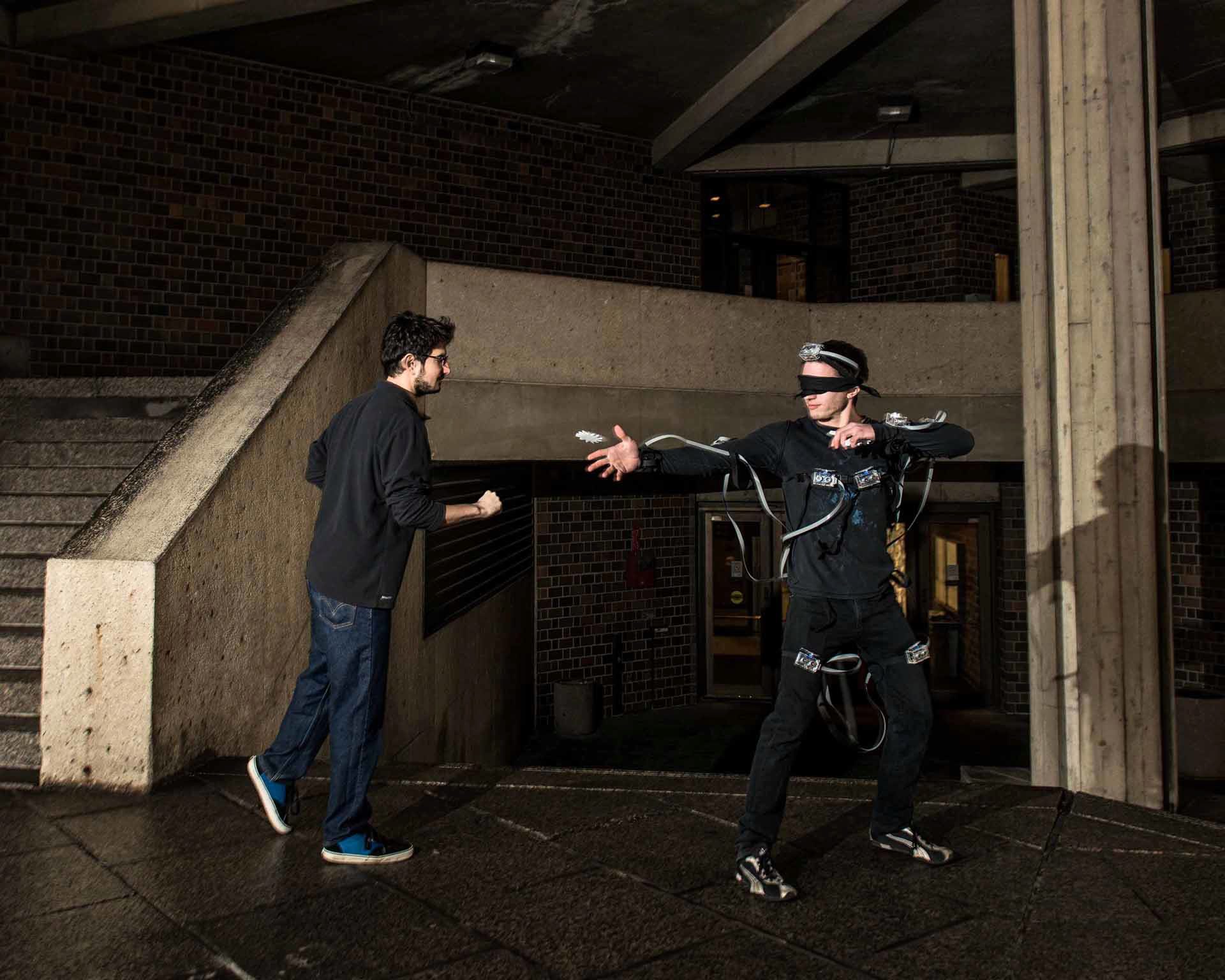 Alex Simes and Khairi Reda, UIC Computer Science graduate students and EVL research assistants, test out the “SpiderSense” suit
